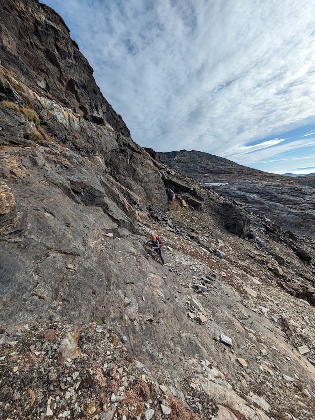 Climbing loose rock past the first crux